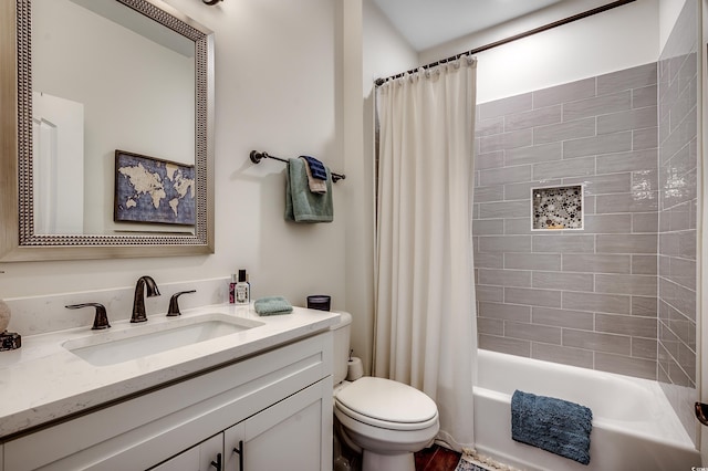 full bathroom featuring shower / tub combo with curtain, toilet, and vanity