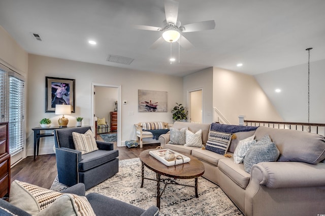 living room featuring recessed lighting, visible vents, and dark wood-style flooring