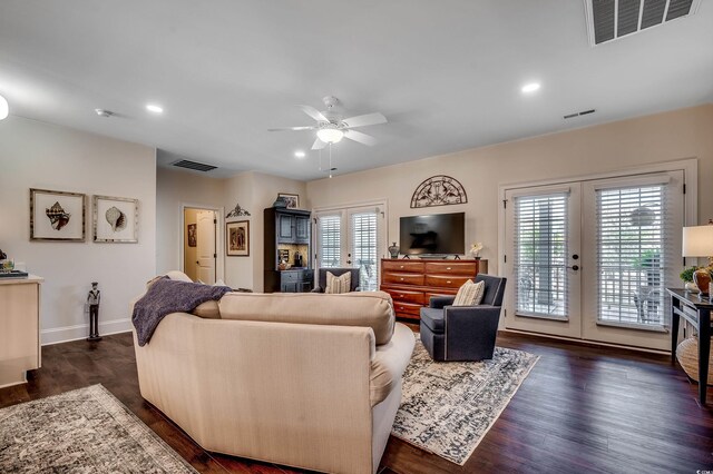 living room featuring dark wood-style floors, visible vents, recessed lighting, and french doors