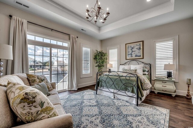 bedroom with visible vents, crown molding, a tray ceiling, and access to outside