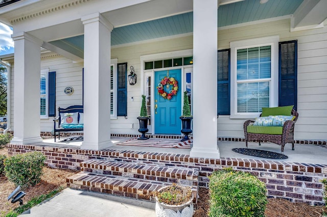 doorway to property with covered porch