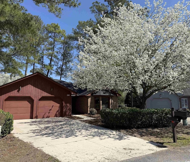 view of front of home with an attached garage and driveway