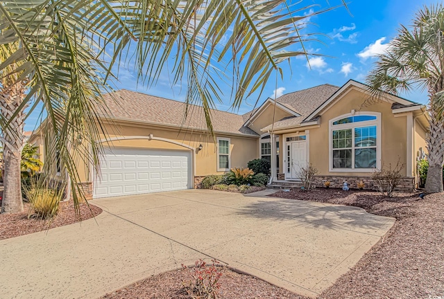 single story home with a shingled roof, stucco siding, a garage, stone siding, and driveway