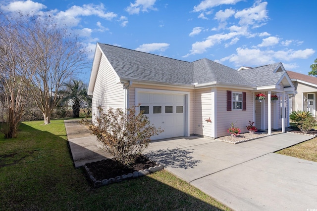 view of property exterior with a yard, roof with shingles, concrete driveway, and an attached garage