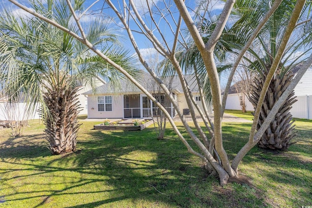 exterior space with a garden and fence