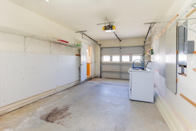 garage featuring washer / clothes dryer and a garage door opener