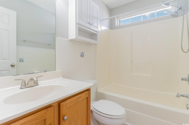 full bathroom featuring shower / tub combination, vanity, and toilet