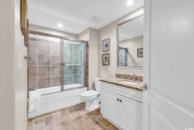 bathroom with visible vents, toilet, recessed lighting, combined bath / shower with glass door, and vanity