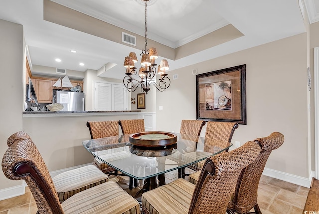dining space with an inviting chandelier, baseboards, and visible vents