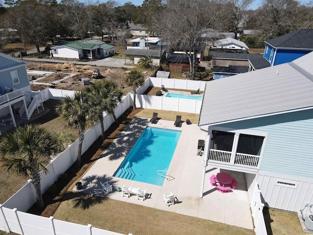 exterior space with a patio, a fenced backyard, and a fenced in pool