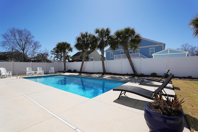 view of swimming pool featuring a fenced backyard, a fenced in pool, and a patio