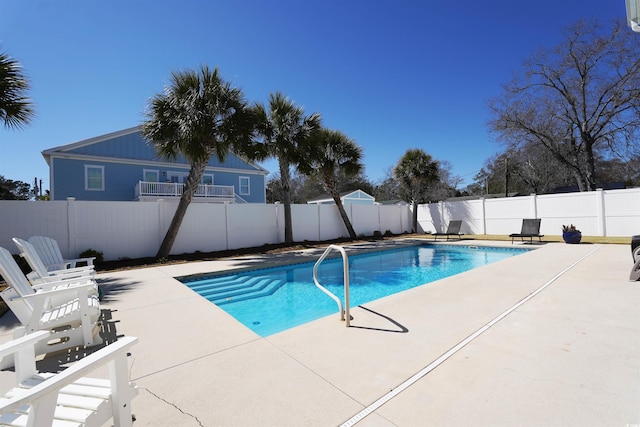 view of pool with a patio, a fenced backyard, and a fenced in pool