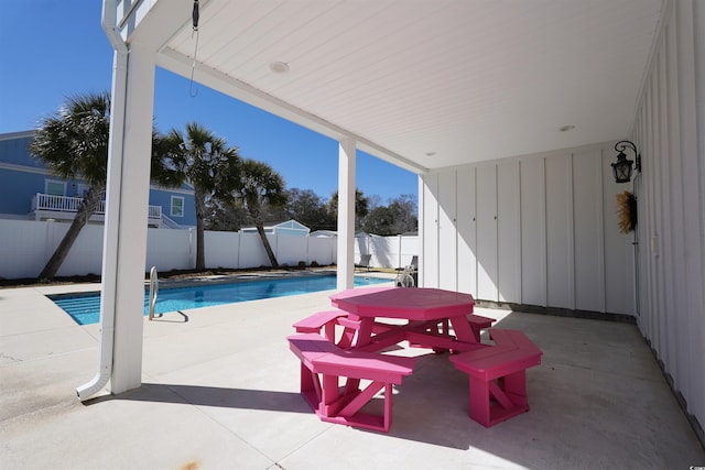 view of swimming pool featuring a patio area, a fenced in pool, and a fenced backyard