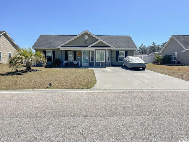 view of front of home with a front yard and fence