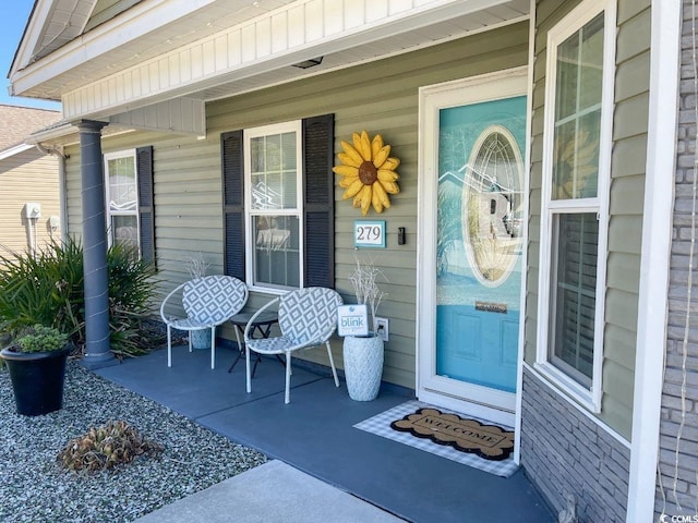 doorway to property with a porch