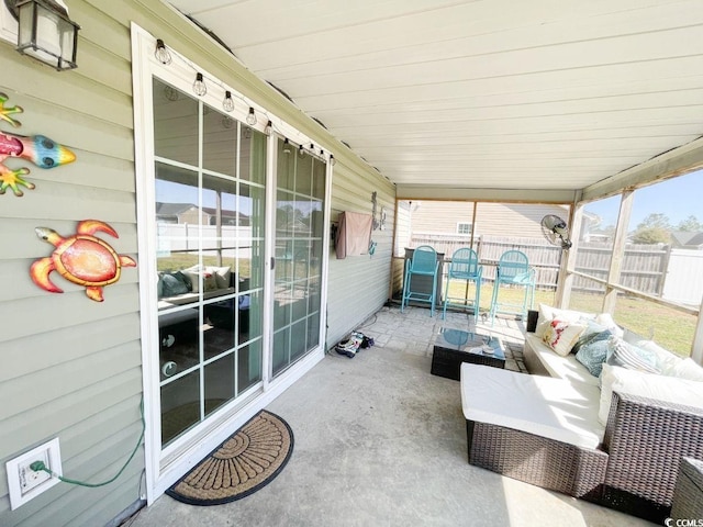 view of patio / terrace featuring outdoor lounge area and fence