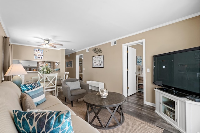 living area featuring a ceiling fan, crown molding, dark wood-style floors, and visible vents