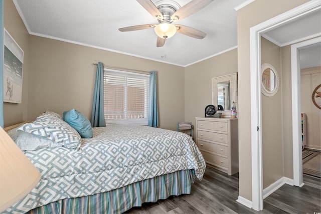 bedroom with ceiling fan, baseboards, wood finished floors, and crown molding