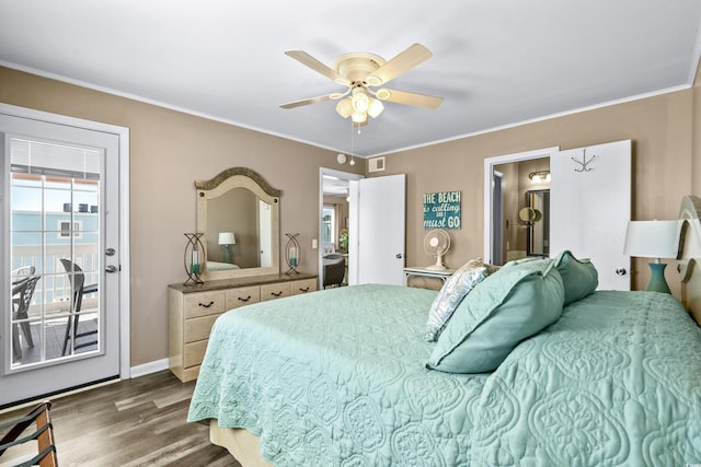 bedroom with visible vents, ornamental molding, wood finished floors, baseboards, and ceiling fan