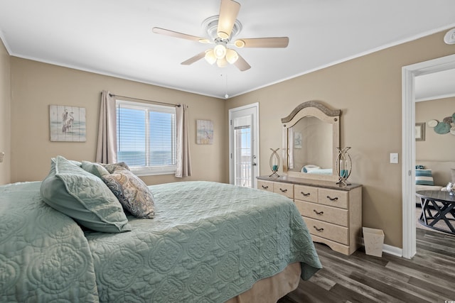 bedroom with crown molding, baseboards, dark wood-type flooring, and ceiling fan