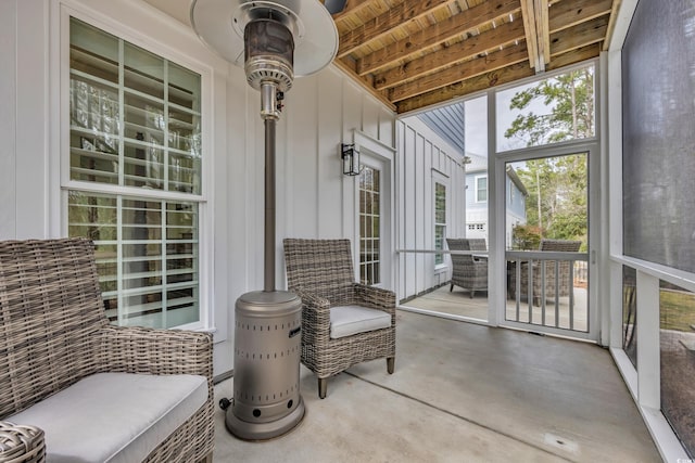 sunroom / solarium with beamed ceiling and wood ceiling