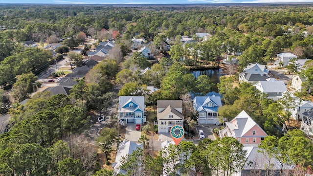 aerial view featuring a residential view and a view of trees