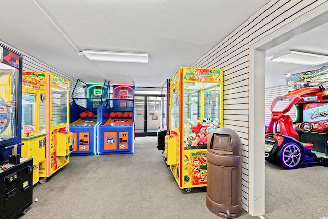 rec room with carpet flooring and a textured ceiling