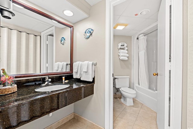 full bath with tile patterned flooring, toilet, shower / tub combo, and a sink