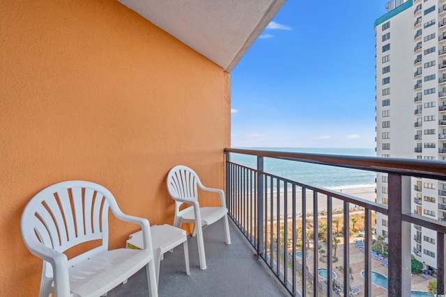 balcony with a view of the beach and a water view