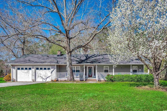 ranch-style house with a garage, covered porch, a front yard, and aphalt driveway