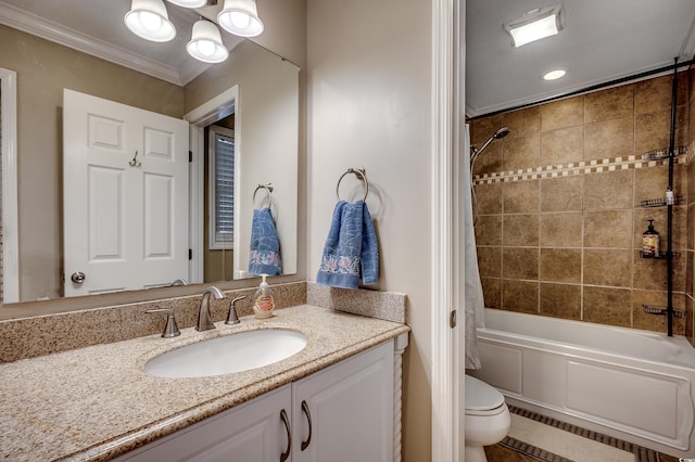 full bath featuring vanity, crown molding, toilet, and shower / bath combo