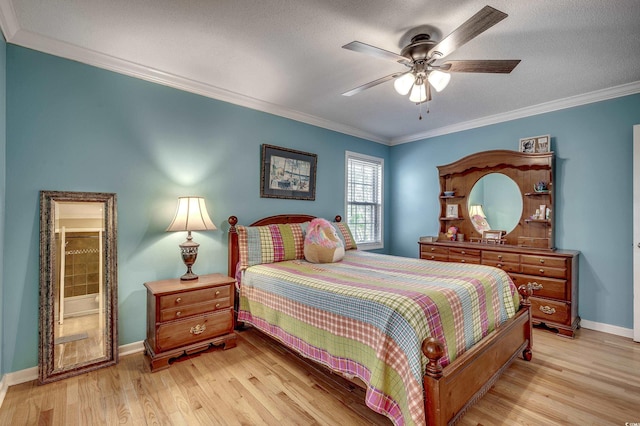 bedroom featuring a ceiling fan, baseboards, light wood-style flooring, a textured ceiling, and crown molding