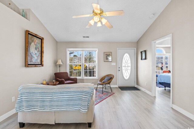 2029 Hawksmoor Dr, Conway, SC 29526 - bedroom with wood finished floors, baseboards, vaulted ceiling, and visible vents