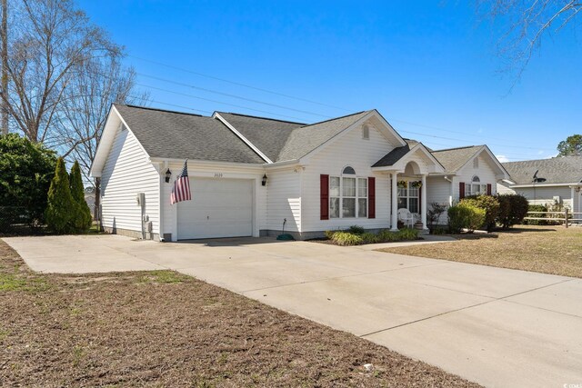 2029 Hawksmoor Dr, Conway, SC 29526 - view of front facade with concrete driveway, a shingled roof, and an attached garage