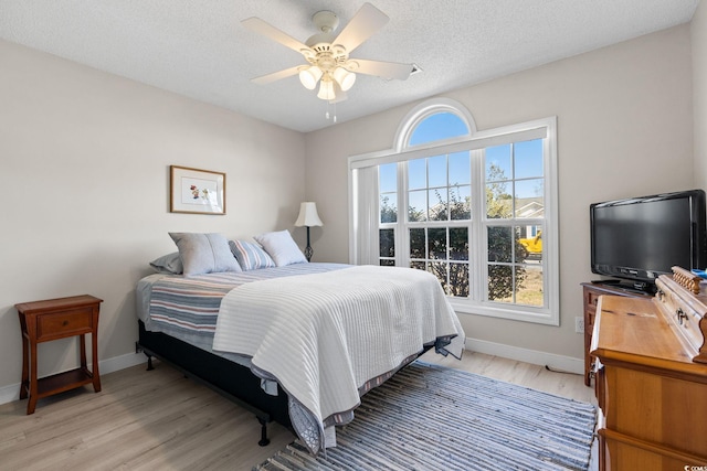 2029 Hawksmoor Dr, Conway, SC 29526 - bedroom with light wood-type flooring, multiple windows, baseboards, and a ceiling fan