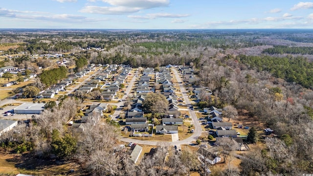 aerial view with a residential view and a wooded view