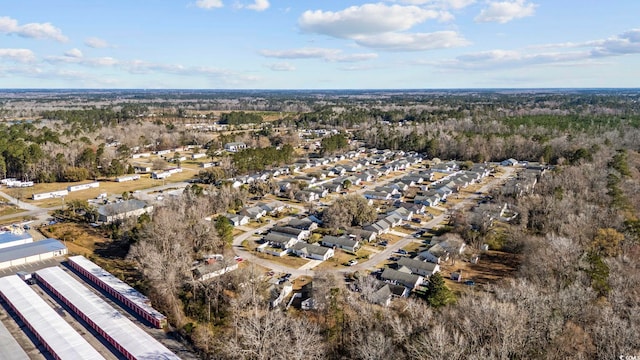 birds eye view of property with a residential view