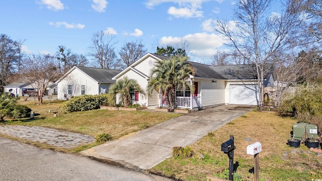 ranch-style house featuring a garage, covered porch, driveway, and a front lawn