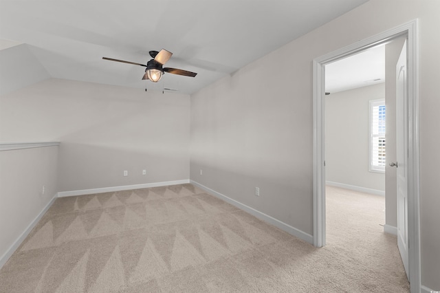 empty room featuring baseboards, carpet, and ceiling fan