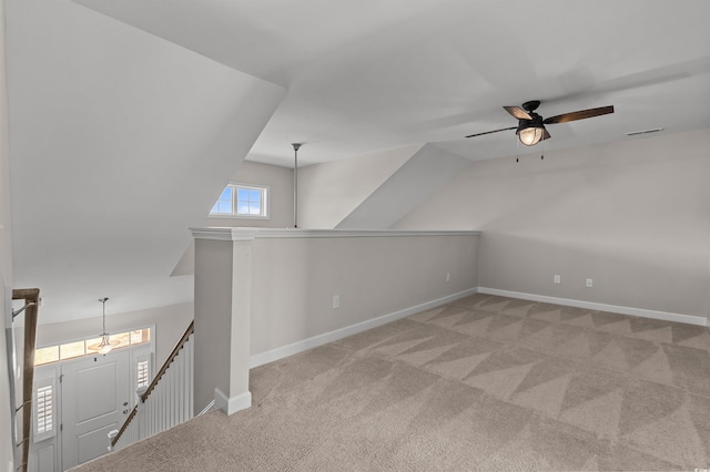 bonus room featuring visible vents, baseboards, a ceiling fan, and carpet floors