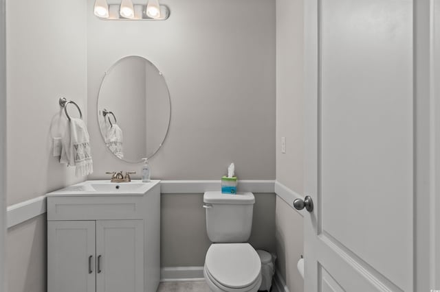 bathroom with toilet and vanity