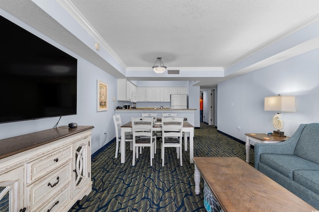 2201 S Ocean Blvd Unit 1707, Myrtle Beach, SC 29577 - dining space with dark colored carpet, ornamental molding, baseboards, a tray ceiling, and a textured ceiling