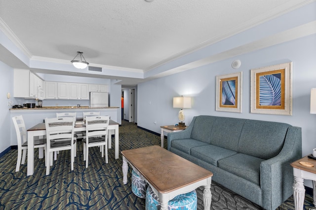2201 S Ocean Blvd Unit 1707, Myrtle Beach, SC 29577 - living area featuring crown molding, dark carpet, a raised ceiling, a textured ceiling, and baseboards