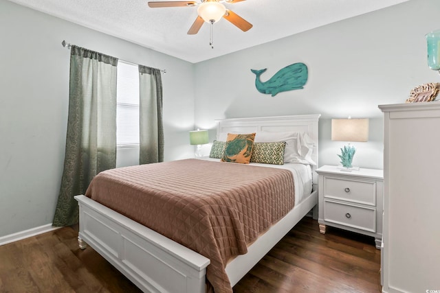 bedroom with ceiling fan, baseboards, a textured ceiling, and wood finished floors