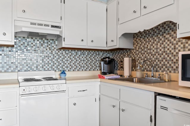 kitchen with under cabinet range hood, light countertops, white appliances, white cabinetry, and a sink