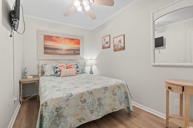 6000 N Ocean Blvd Unit 204, North Myrtle Beach, SC 29582 - bedroom featuring wood finished floors, crown molding, baseboards, and a ceiling fan