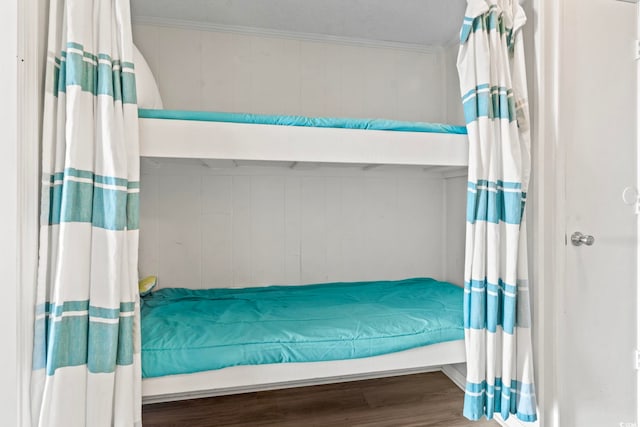bedroom featuring wood finished floors