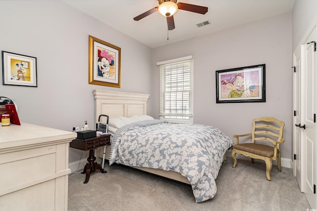 bedroom with light carpet, visible vents, and baseboards