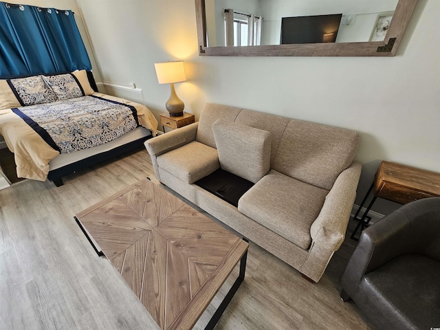 bedroom featuring wood finished floors