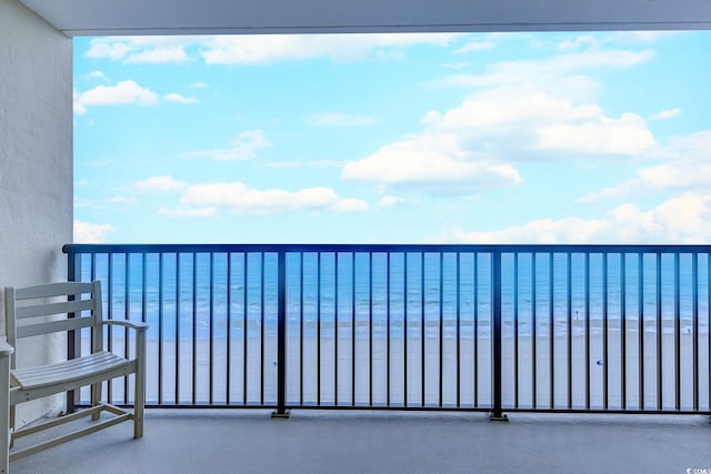 balcony featuring a water view